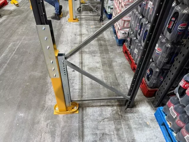 Installed racking upright in warehouse aisle